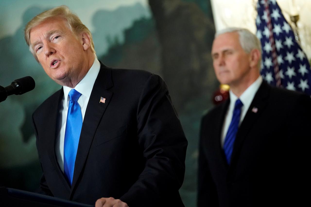 U.S. President Donald Trump, flanked by Vice President Mike Pence, delivers remarks recognizing Jerusalem as the capital of Israel at the White House in Washington