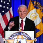 Image: U.S. Attorney General Jeff Sessions delivers remarks on law enforcement efforts to combat the opioid crisis and violent crime in an address before the National Sheriffs Association Winter Conference in Washington