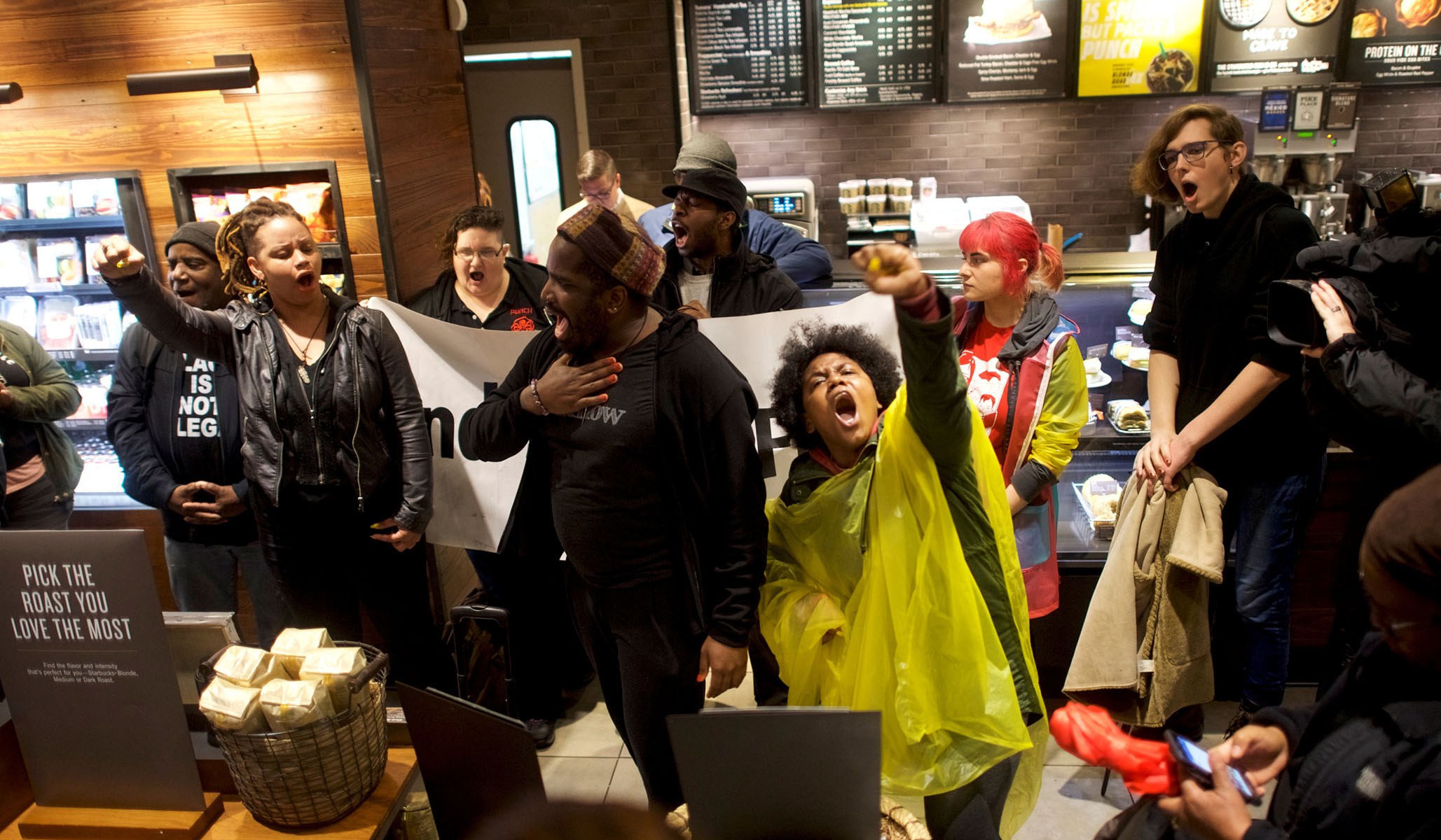 Protestors demonstrate inside a Center City Starbucks, where two black men were arrested, in Philadelphia