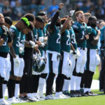 Philadelphia Eagles stand for National Anthem