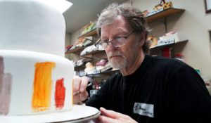 Baker Jack Phillips decorates a cake in his Masterpiece Cakeshop in Lakewood