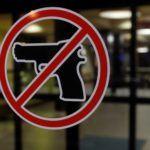 No gun sign posted outside a hotel