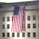 911 flag hanging from the pentagon