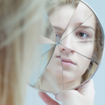 Mental disorder - girl w broken mirror