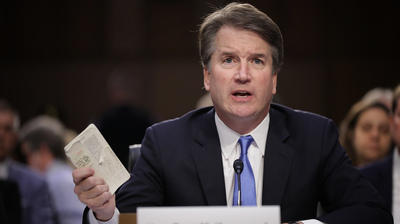 SC nominee Kavanaugh holds up small copy of US Constitution