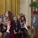 White House intern attempts to get mic from Acosta