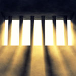 Prison bars w light coming thru
