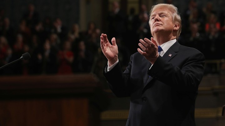 U.S. President Donald Trump applauds