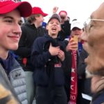 Student from Covington Catholic HS in front of Nathan Phillips in Washington