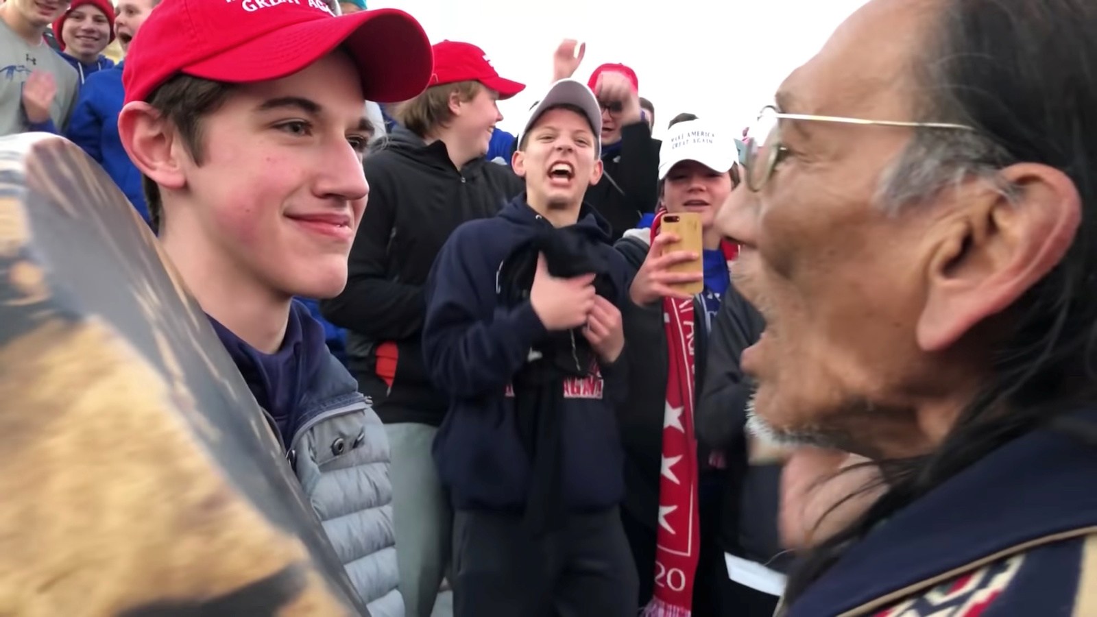 Student from Covington Catholic HS in front of Nathan Phillips in Washington