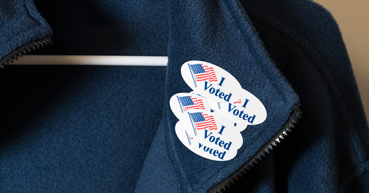 voter fraud-jacket with lots of I Voted stickers