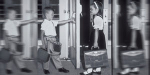 Boy hold door for girl