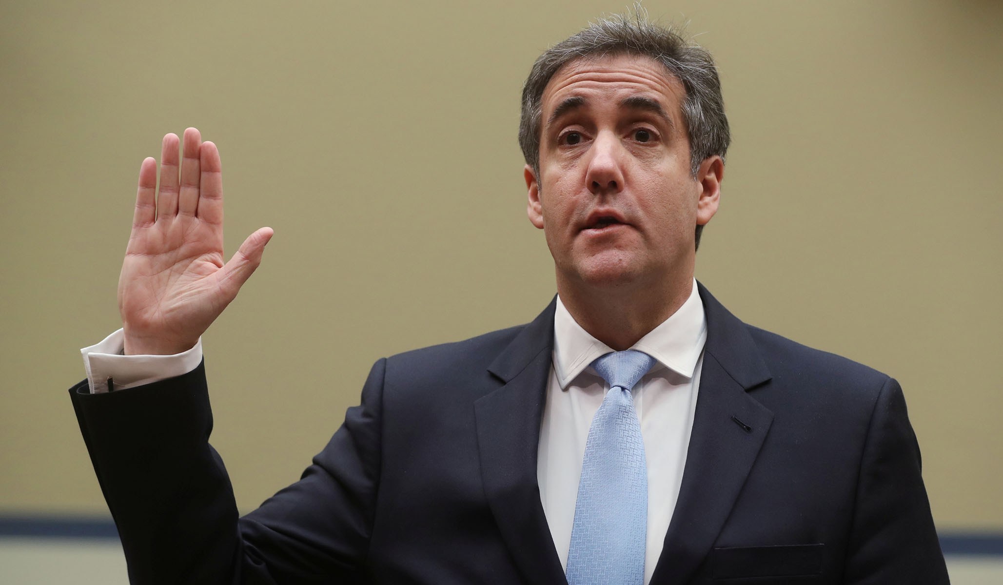 Michael Cohen swears in to testify