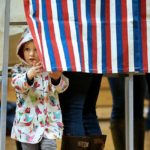 voting booth - small child peeking