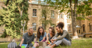 students sitting on campus