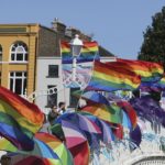 Demonstration - gay flags & Umbrellas on a bridge