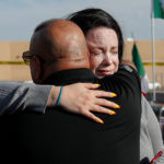 Family members hug in El Paso
