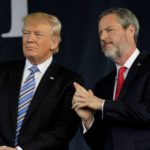 President Donald Trump stands with Liberty University President Jerry Falwell, Jr.