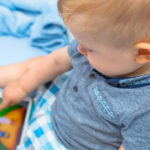 toddler with electronic game