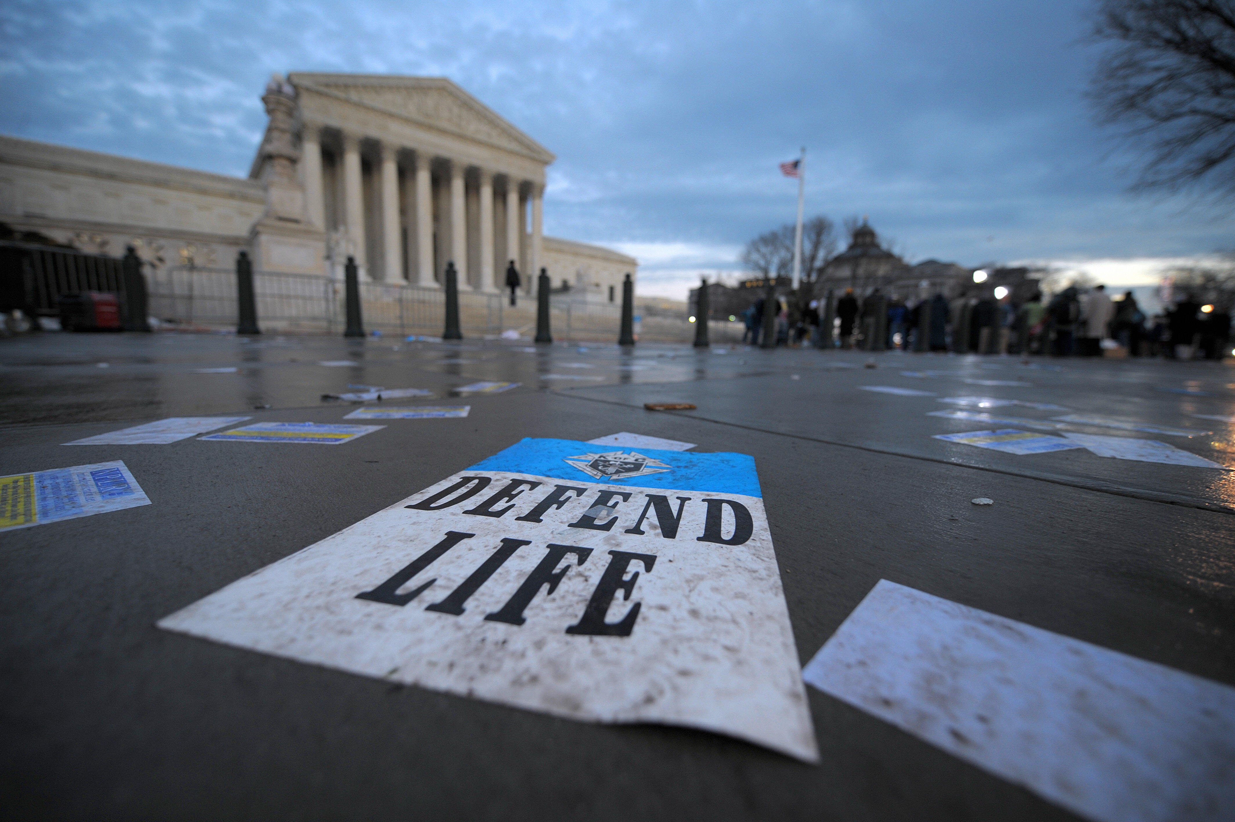 Defend Life poster on steps of SCOTUS bldg