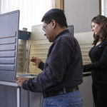 Man and woman voting