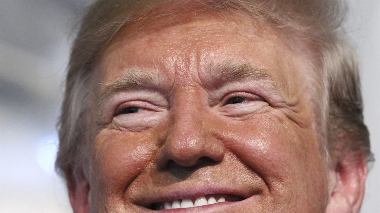 Trump grinning