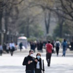 couple wearing masks in Central Park