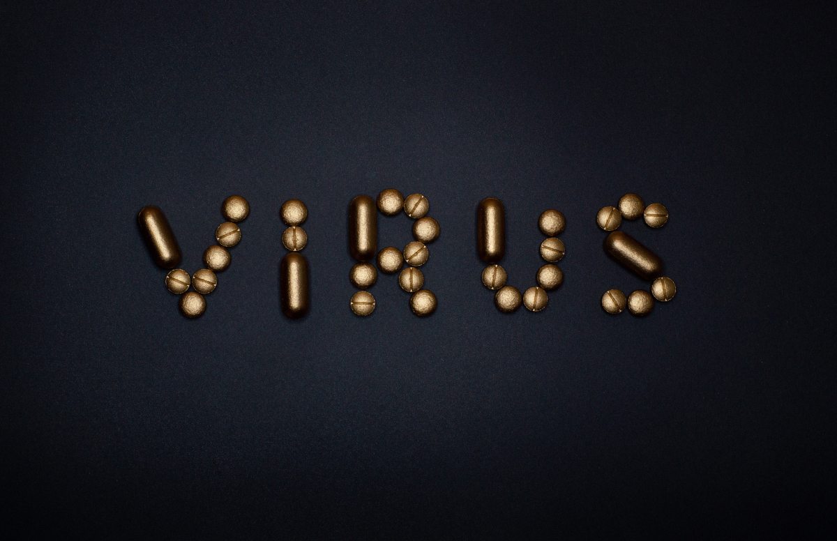 pills-on-blue-background spelling VIRUS