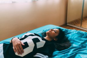a Gen-Z-girl on a bed
