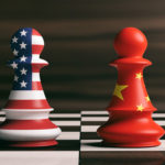 USA and China flags on chess pawns on a chessboard
