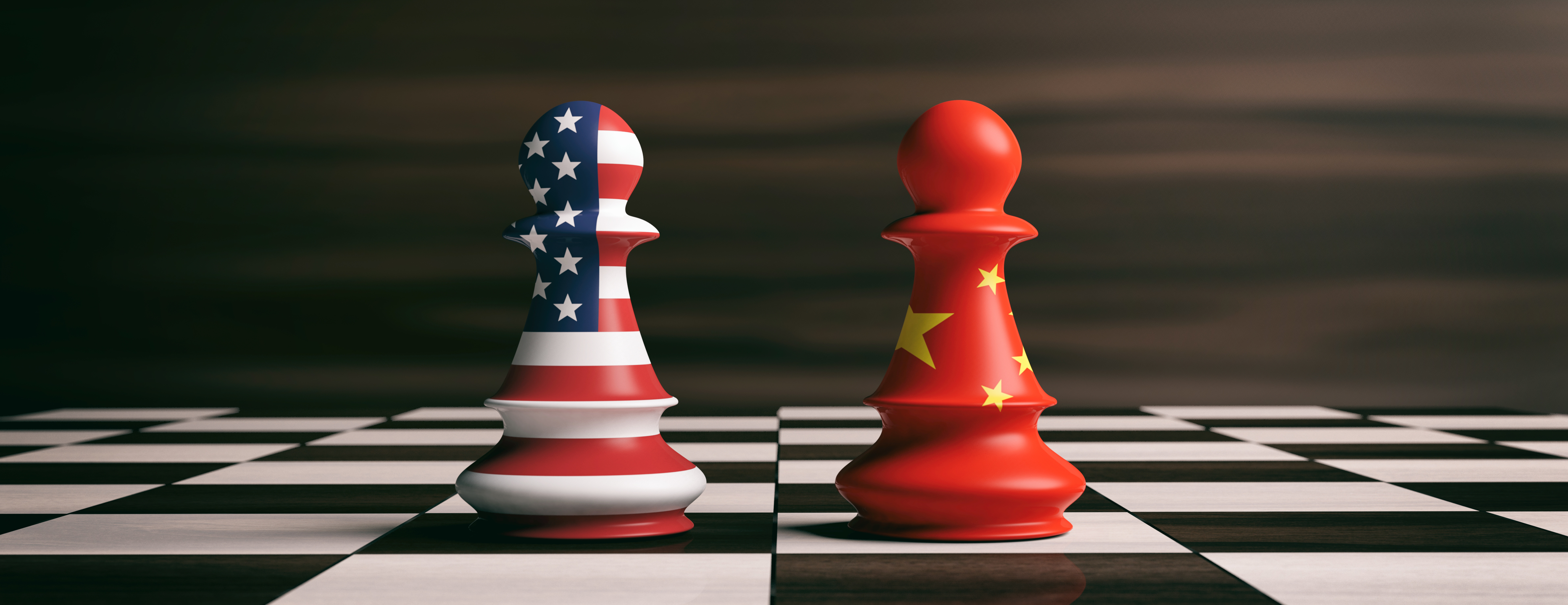 USA and China flags on chess pawns on a chessboard