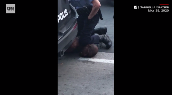 Officer has knee on George Floyd