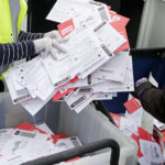 Postal workers bins of mail in ballots 2