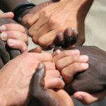 blacks-and-whites-holding hands