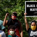 masked crowd of protesters black lives matter