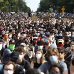 Mass of mask wearing peaceful protesters