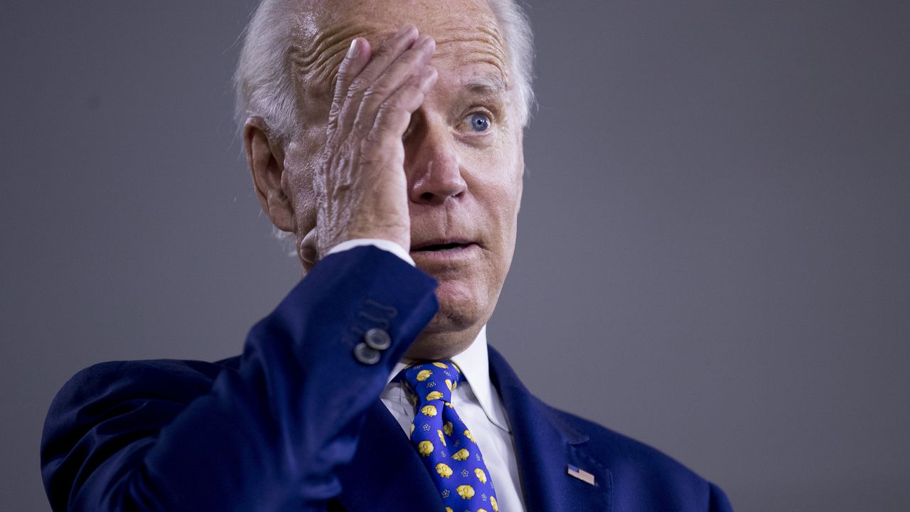 Joe Biden rubs his temple