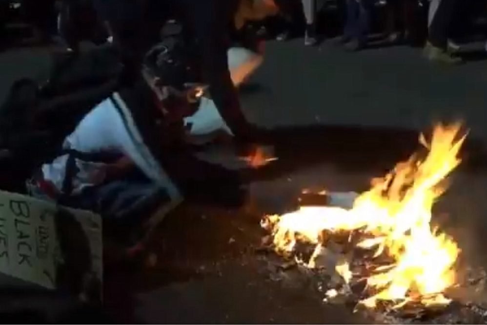 Portland protsters burning Bibles