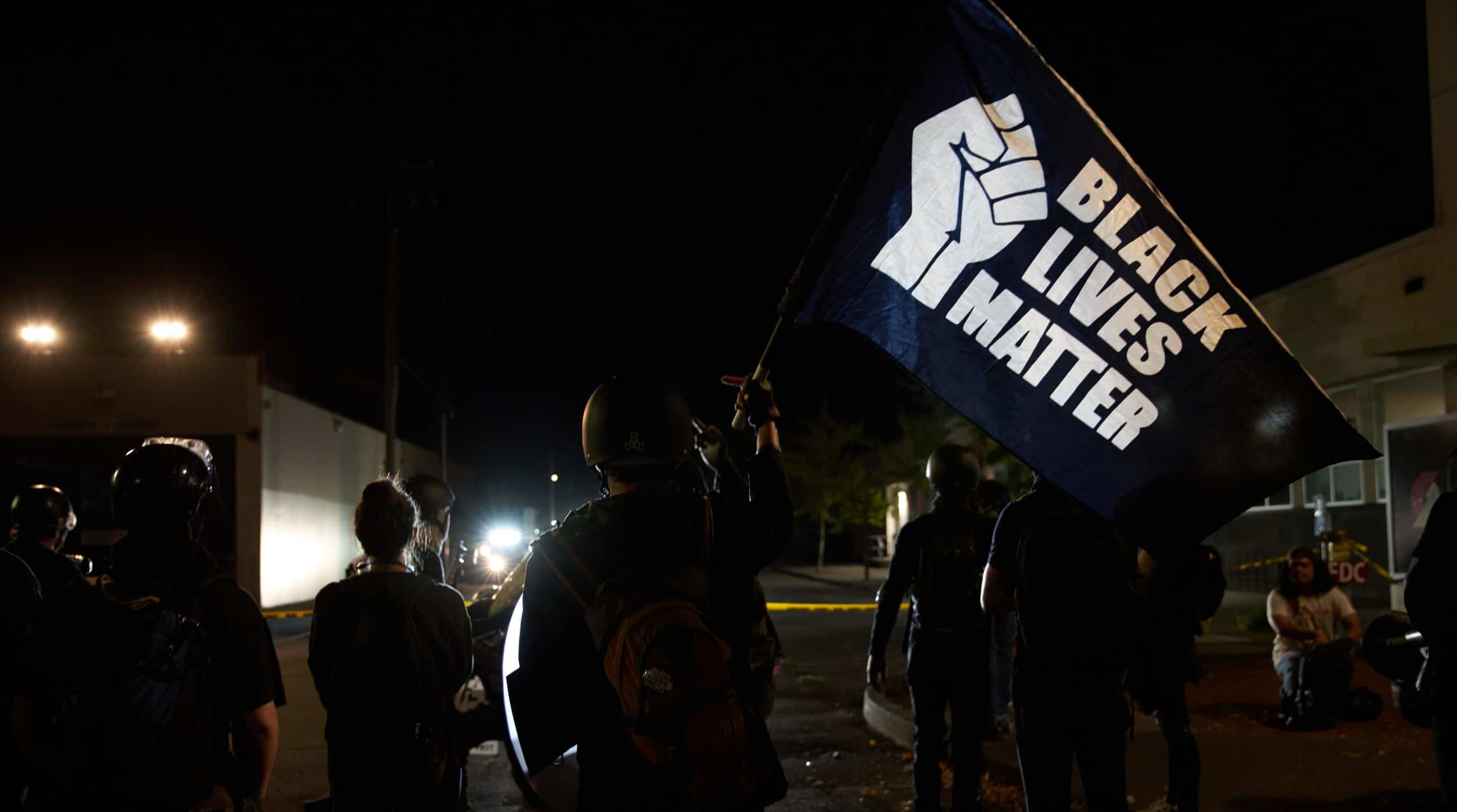 Protesters w Black Lives Matter Flag