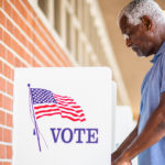 Elderly Black Man Voting