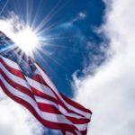 american flag waving in the sun