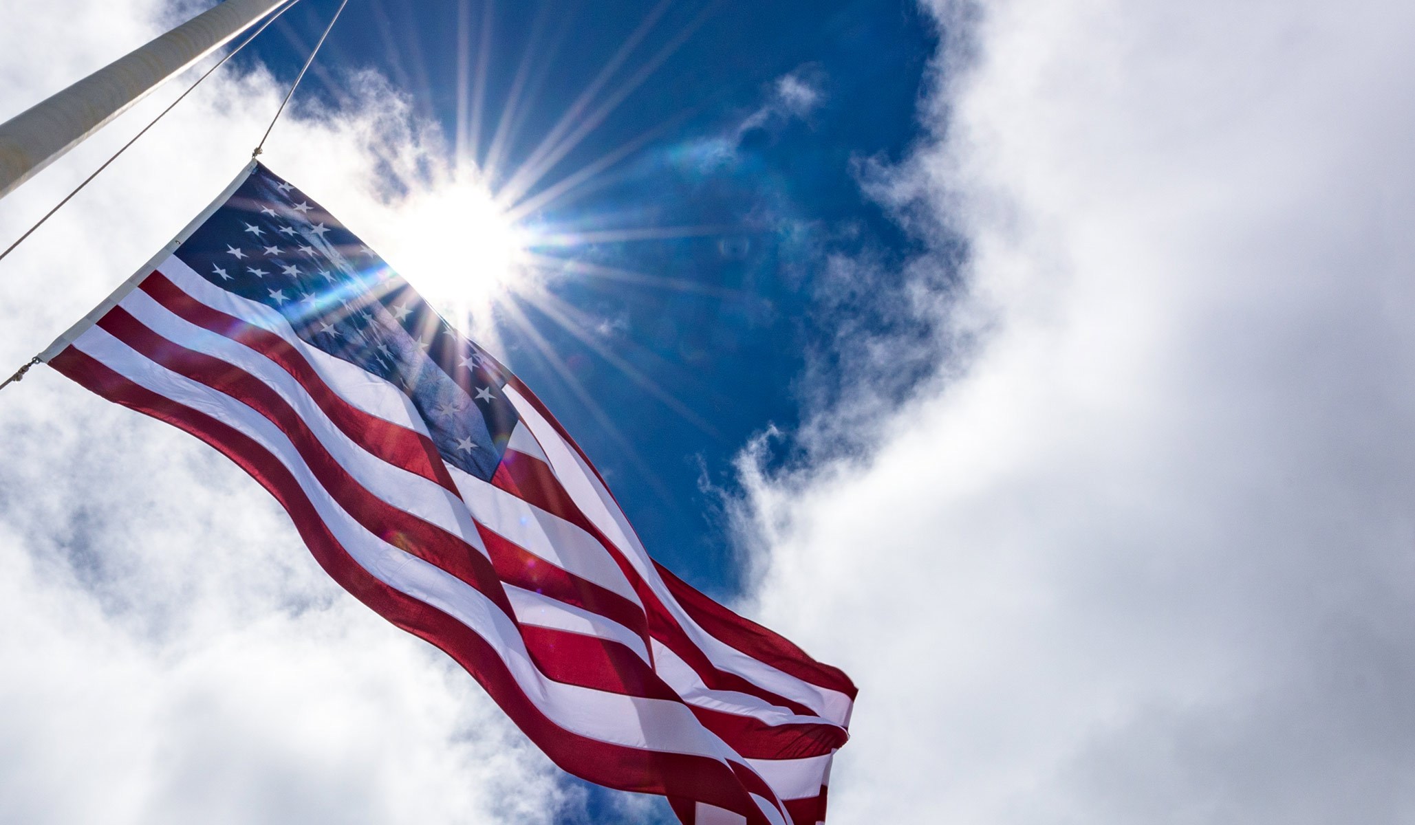 american flag waving in the sun