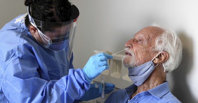Elderly Man getting nose swab for COVID