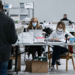 Poll workers counting ballots