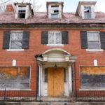 Urban-Poverty-abandoned-boarded-brick-house
