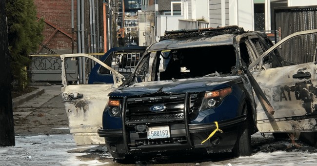 burned beat-up police car in Seattle