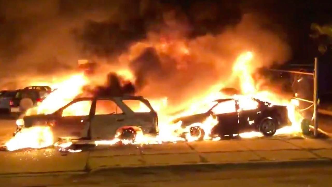 cars burning protesters violence