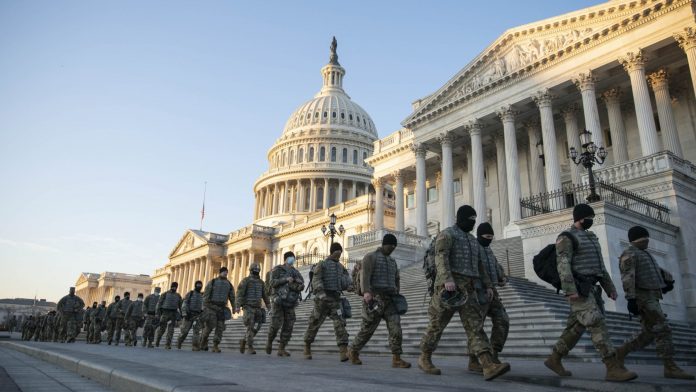 national guard marches in front of capitol