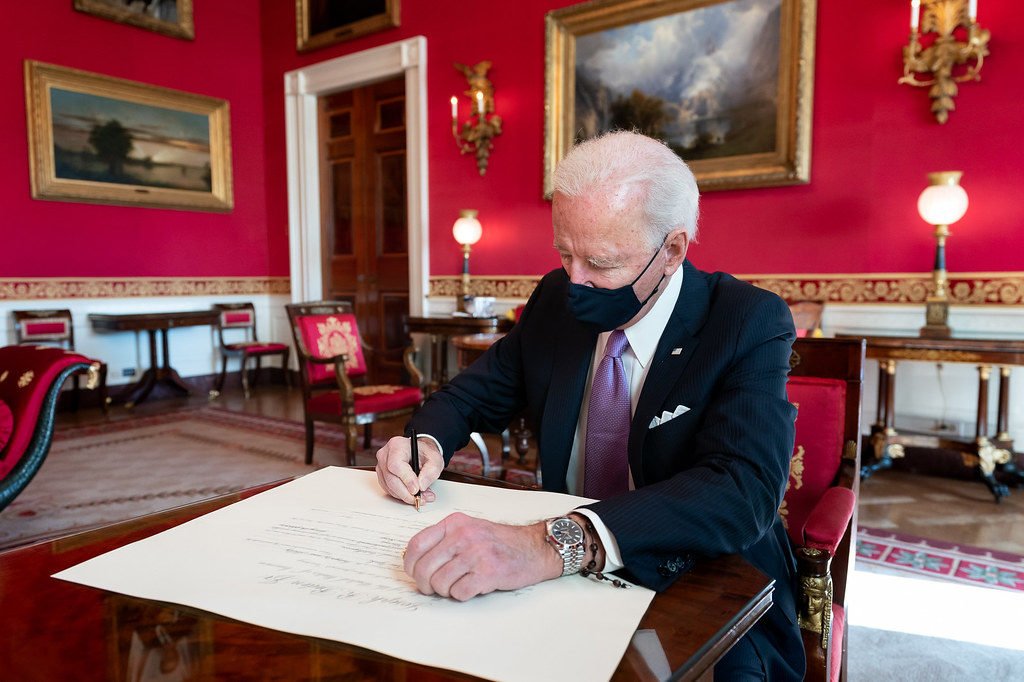 Biden in red room - signs proclamation