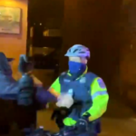 Protester hits DC Police Officer